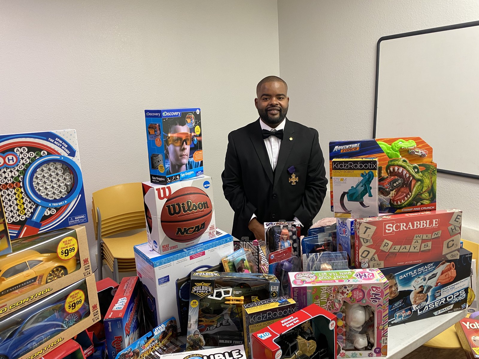 Anton Crosby Sr. with toys collected for the children at Ebony House in Phoenix