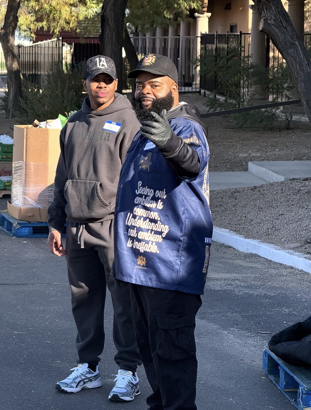 Anton Crosby Sr. with a young volunteer at a food distribution